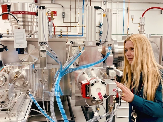 Charlotte Pearson inspects the new radiocarbon analysis instrument recently installed at the Laboratory for Tree-Ring Research.