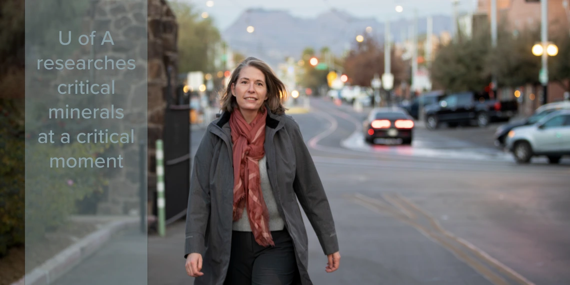 Woman walking at U of A main gate